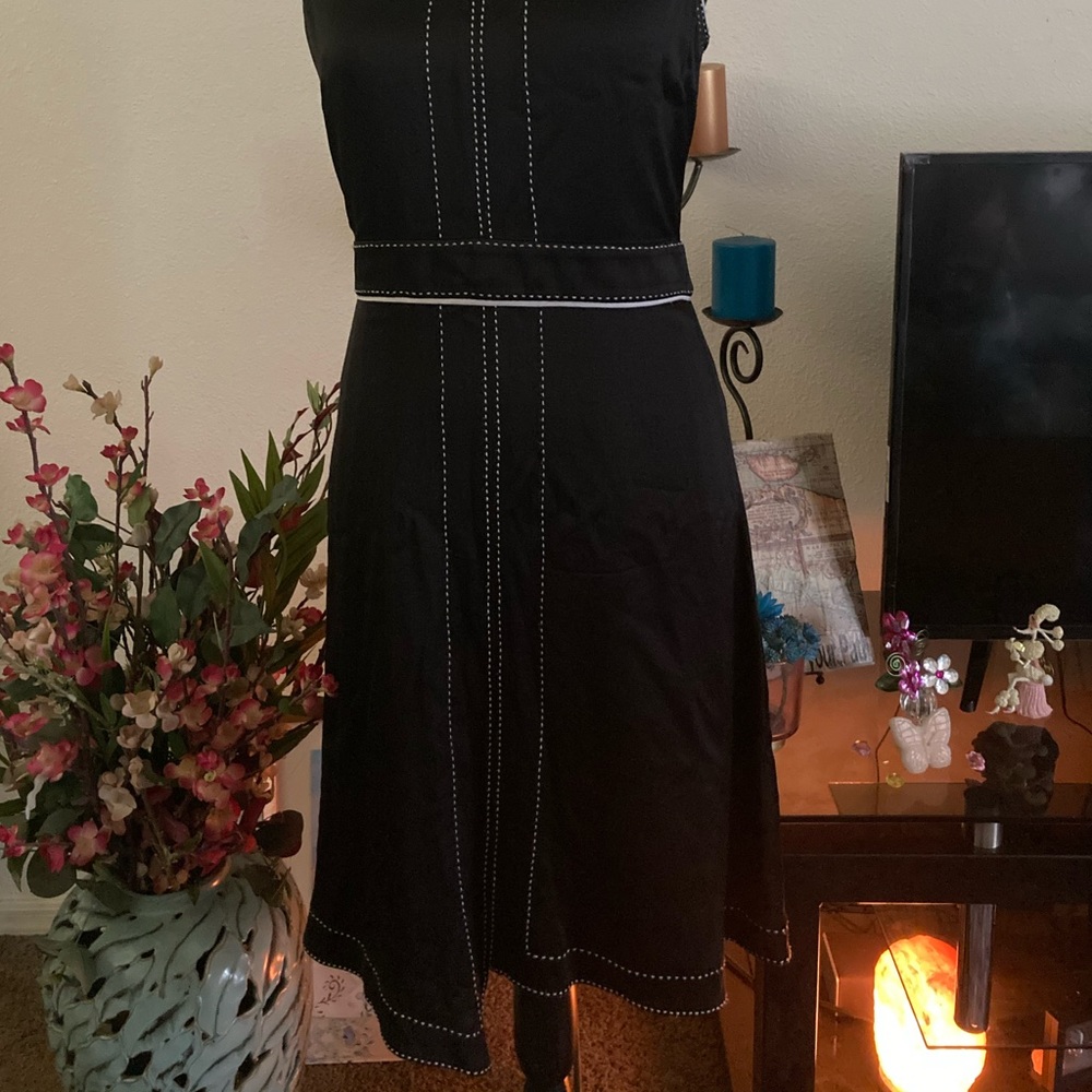 Black dress with white bordered stitching